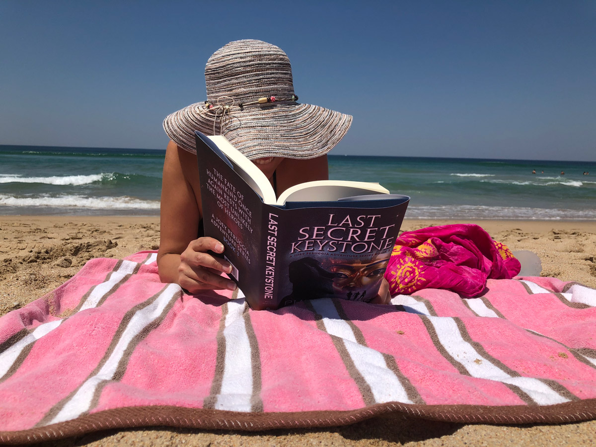Reading Last Secret Keystone at Beach