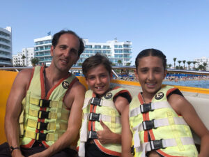 Phil Philips parasailing with children